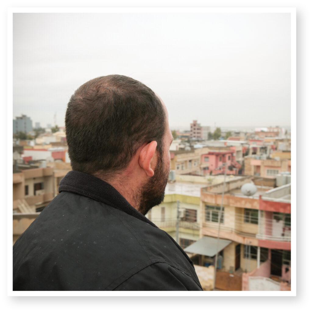 Man standing look out over a city