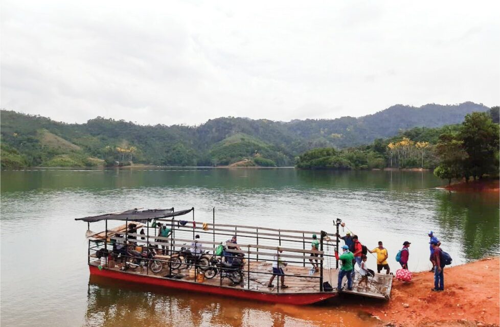 Colombia Pastors Travel Miles For Fellowship and Bibles Colombian front line workers load bibles onto a boat