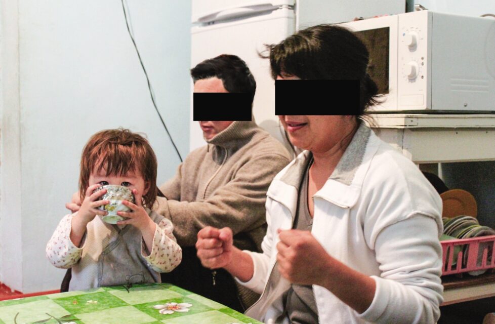 Christian Refuses to Marry a Muslim, Threatened by Family a husband and wife sit with their daughter at their kitchen table