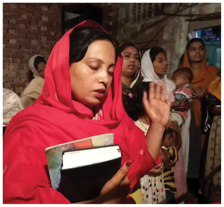 A woman worshipping in church